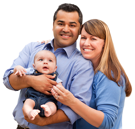 A man and a woman holding a baby